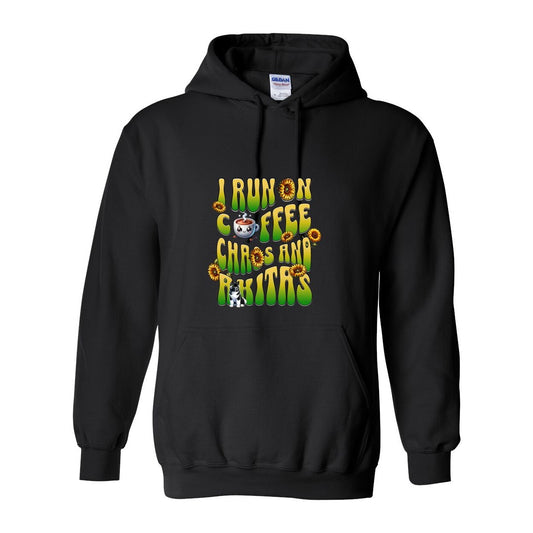 Black hooded hooded sweatshirt with text 'I RUN ON COFFEE CHAOS AND Akitas' featuring colorful graphics.