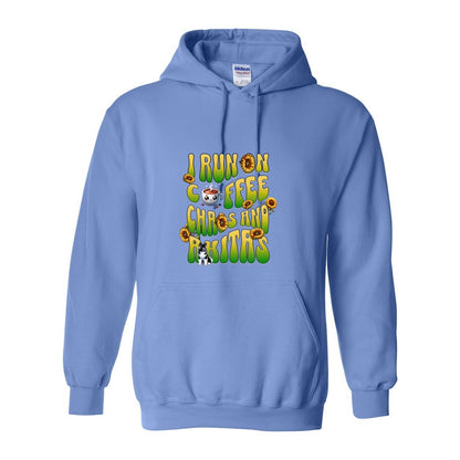 Light blue hooded sweatshirt with text 'I RUN ON COFFEE CHAOS AND Akitas' featuring colorful graphics.